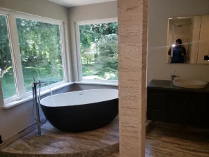 Modern freestanding soaking tub and bathroom fixture plumbing upgrade
