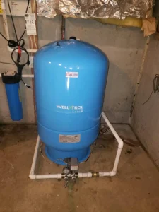 Well pressure tank installation and filtration system by a Maryland plumber