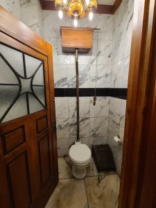 High-tank historic residential toilet installation and water supply line repair