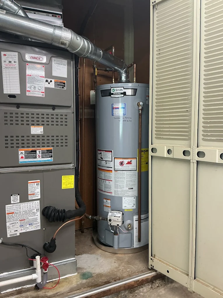 Energy-efficient residential water heater installed in utility closet